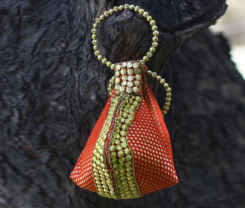Vogue Crafts & Designs Pvt. Ltd. manufactures Orange Beadwork Potli Bag at wholesale price.