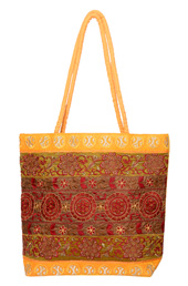 Vogue Crafts and Designs Pvt. Ltd. manufactures Yellow Embroidered Bag at wholesale price.