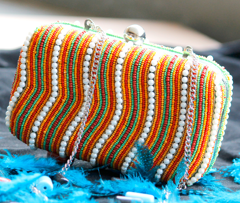 Vogue Crafts & Designs Pvt. Ltd. manufactures Colorful Waves Box Clutch at wholesale price.