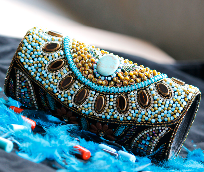 Vogue Crafts & Designs Pvt. Ltd. manufactures Beads and Flowers Clutch at wholesale price.