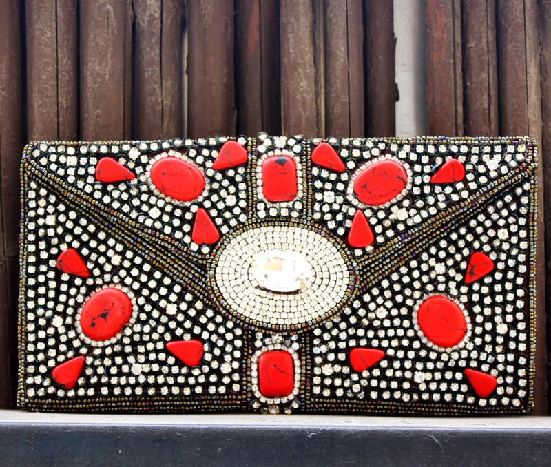 Vogue Crafts & Designs Pvt. Ltd. manufactures Dots of Red Envelope Clutch at wholesale price.