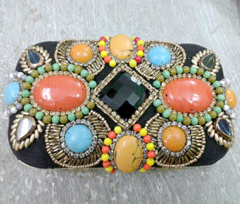 Vogue Crafts & Designs Pvt. Ltd. manufactures The Embossed-Stones Clutch at wholesale price.