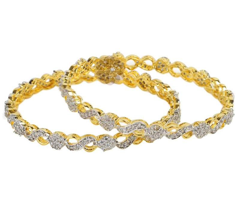 Vogue Crafts & Designs Pvt. Ltd. manufactures Designer Gold and Diamond Pair of Bangles at wholesale price.