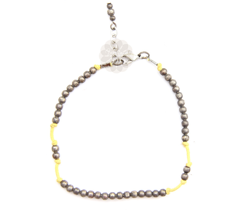 Vogue Crafts & Designs Pvt. Ltd. manufactures Yellow String and Silver Ball Anklet at wholesale price.