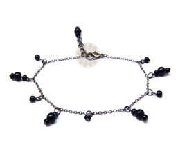 Vogue Crafts and Designs Pvt. Ltd. manufactures Dangling Black Bead Anklet at wholesale price.