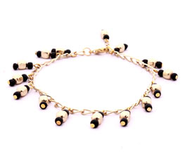 Vogue Crafts and Designs Pvt. Ltd. manufactures Golden and Black Bead Anklet at wholesale price.