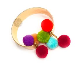 Vogue Crafts and Designs Pvt. Ltd. manufactures Trendy Pom Pom Bracelet at wholesale price.