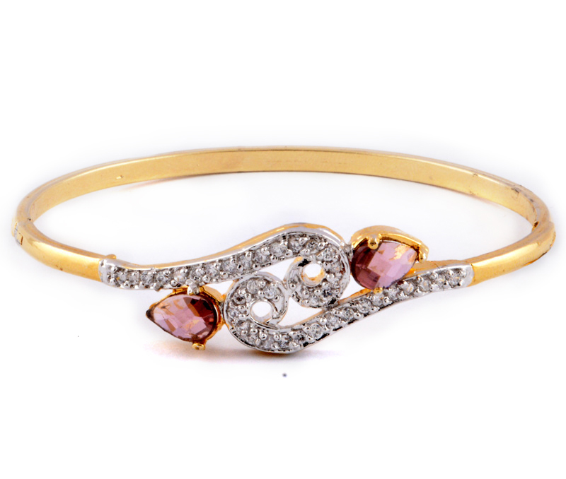 Vogue Crafts & Designs Pvt. Ltd. manufactures Golden Bracelet with Pink Trumulin stones at wholesale price.