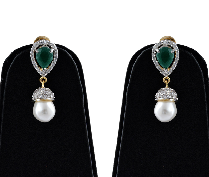 Vogue Crafts & Designs Pvt. Ltd. manufactures Brass American Diamond Earrings with Emerald at wholesale price.