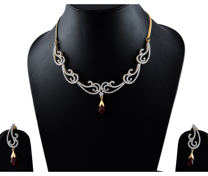 Vogue Crafts & Designs Pvt. Ltd. manufactures American Diamonds with Maroon Stone Earrings-Necklace set at wholesale price.