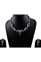 Vogue Crafts and Designs Pvt. Ltd. manufactures American Diamonds with Maroon Stone Earrings-Necklace set at wholesale price.