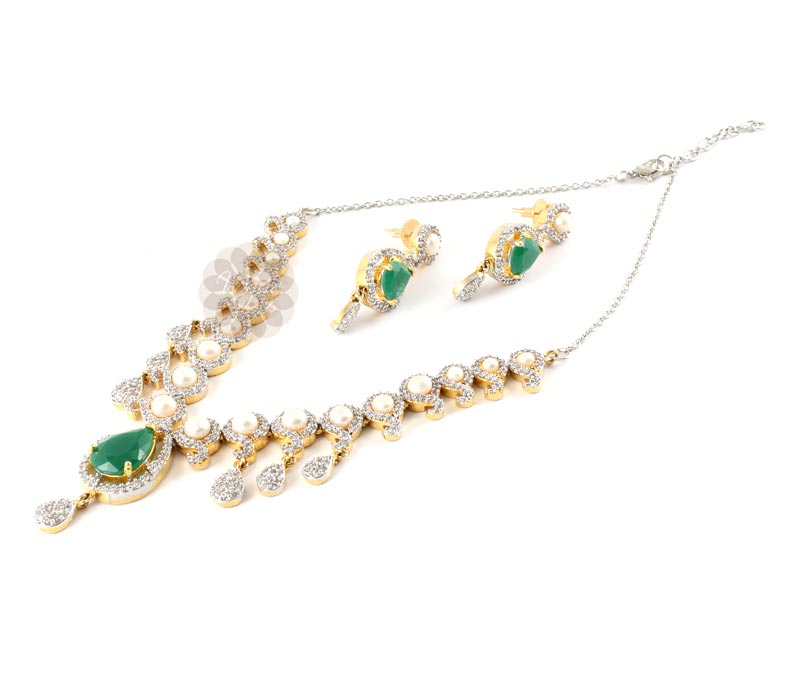 Vogue Crafts & Designs Pvt. Ltd. manufactures Pearly Emerald Earrings-Necklace set at wholesale price.