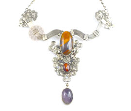 Vogue Crafts and Designs Pvt. Ltd. manufactures Gold Plated Resin Stone Necklace at wholesale price.